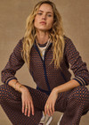 THE UPSIDE women's brown organic cotton Lumiere Margot Knit Jacket is a knitted long sleeve with a geometric star pattern, front pockets and contrast stripes around the sleeves. Made for lifestyle.
