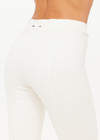 THE UPSIDE women's cream Bonnie Kick Flare Pant is a mid-rise, cropped flare pant made in a heavy ponte fabrication with a soft elastic waistband and embroidered arrow logo at back.