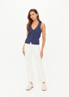 THE UPSIDE women's cream Bonnie Kick Flare Pant is a mid-rise, cropped flare pant made in a heavy ponte fabrication with a soft elastic waistband and embroidered arrow logo at back.
