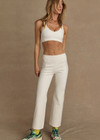 THE UPSIDE women's cream Bonnie Kick Flare Pant is a mid-rise, cropped flare pant made in a heavy ponte fabrication with a soft elastic waistband and embroidered arrow logo at back.