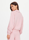 THE UPSIDE women's pink organic cotton french terry McGrath Collared Elle Polo is a relaxed, long sleeve polo with a collar and front buttons. Made for lifestyle.