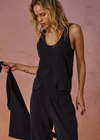 THE UPSIDE women's black recycled cotton Soho Jacquie Tank Top is designed for a relaxed fit and features a ribbed neckline and armhole. Made for everyday leisure.