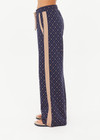 THE UPSIDE women's monogram jacquard Ezra Nova Flare Pant features a monogram geometric design and an elasticated waistband with drawcord. Made for lifestyle.