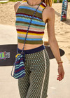 THE UPSIDE women’s stripe organic cotton Cabana Crochet Mini Bag is crossbody and handmade with a navy paracord strap and cord with toggle. Made for lifestyle.