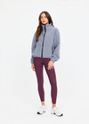 THE UPSIDE women’s grey recycled Sol Fleece Jacket has a relaxed fit with elastic waist and arm cuffs with polar fleece fabrication in marle. Made for lifestyle.