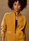 THE UPSIDE women's yellow organic cotton Bonito Dylan Knit Jacket offers a relaxed fit and features raglan sleeves, front patch pockets and contrast stripe detailing. Made for lifestyle.
