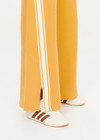 THE UPSIDE women's yellow organic cotton Bonito Moby Knit Pant is designed for a soft and supportive fit and features a high rise waist, side stripe detailing and adjustable drawcord. Made for lifestyle.