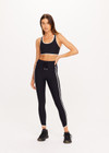THE UPSIDE women's black Sol 25inch Midi Legging offers a soft and supportive fit with a mid rise waist, side stripe detailing, pockets and adjustable drawcord. Made for yoga and pilates.
