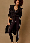 THE UPSIDE women's black Sol 25inch Midi Legging offers a soft and supportive fit with a mid rise waist, side stripe detailing, pockets and adjustable drawcord. Made for yoga and pilates.