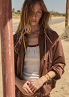 THE UPSIDE women’s brown recycled fabric Lila Zip Through Jacket is designed for a regular fit and features contrast piping, front pockets and a drawcord hem. Made for running.
