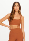 THE UPSIDE women’s brown recycled jacquard Mariana Bridie Sports Bra is designed for a soft, supportive fit and features removable cups and textured fabrication. Made for yoga and pilates.
