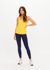 THE UPSIDE women’s yellow recycled mesh Issy Tank Top is a regular fit racerback tank and features a scoop neckline and longline silhouette. Made for performance.