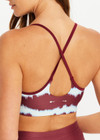 THE UPSIDE women’s tie dye recycled Rio Badu Crossback Sports Bra is a soft and supportive and features a scooped neckline, crossback straps and removable cups. Made for yoga and pilates.