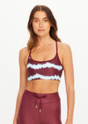 THE UPSIDE women’s tie dye recycled Rio Badu Crossback Sports Bra is a soft and supportive and features a scooped neckline, crossback straps and removable cups. Made for yoga and pilates.