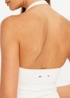 THE UPSIDE women's cream Seamless Halle Halter Top is a soft and supportive style featuring a scoop neckline, low back and built in shelf bra with removable cups. Made for yoga and pilates.