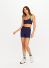 THE UPSIDE women's navy Rhythm Faye Racerback Bra is designed for a supportive and comfortable fit and features a scooped neckline, T-bar back and built in shelf bra with removable cups. Made for pilates.