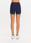 THE UPSIDE women's navy Rhythm 4inch Spin Short is a supportive and comfortable fit and features a mid rise waist, no front seam and contrast side binding. Made for yoga and pilates.