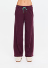 THE UPSIDE women's plum organic cotton Pele Estelle Pant is designed for a relaxed fit and features a wide leg barrel silhouette, elasticated waistband and contrast drawcord detailing. Made for lifestyle.