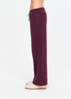 THE UPSIDE women's plum organic cotton Pele Estelle Pant is designed for a relaxed fit and features a wide leg barrel silhouette, elasticated waistband and contrast drawcord detailing. Made for lifestyle.