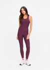 THE UPSIDE women's plum Pele Sophie Tank Top is designed for a supportive and comfortable fit and features a racerback silhouette, built-in shelf bra with removable cups and soft rib fabrication. Made for yoga and pilates.