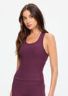 THE UPSIDE women's plum Pele Sophie Tank Top is designed for a supportive and comfortable fit and features a racerback silhouette, built-in shelf bra with removable cups and soft rib fabrication. Made for yoga and pilates.
