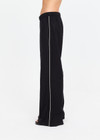 THE UPSIDE women's black lyocell linen blend Noir Elita Pant offers a true to size fit with a mid rise waist, contrast piping and slanted side seam pockets. Made for lifestyle.