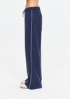 THE UPSIDE women's navy Lago Elita Pant is designed for a true-to-size mid rise fit and features a wide leg silhouette, side pockets and an adjustable drawcord waist. Made for lifestyle.