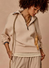 THE UPSIDE women's cream organic cotton Kairo Half Zip Knit is designed for a relaxed fit with a jacquard knit construction, oversized collar and contrast stripe detailing. Made for lifestyle.