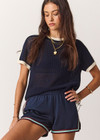 THE UPSIDE women’s navy 100% organic cotton Fenway Jordan Knit Tee offers a relaxed fit and features an open knit construction, contrast sleeve stripe detailing and ribbed trims. Made for lifestyle.