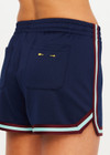 THE UPSIDE women’s navy recycled polyester Cleopatra Short features a mid rise elasticated waistband, curved hem with side splits, back pockets and contrast stripe tape detail. Made for lifestyle.