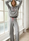 THE UPSIDE women's grey organic cotton Valley Raglan Hoodie offers a relaxed fit and features a hood with a pink drawcord and front patch pocket. The perfect everyday hoodie, made to last.