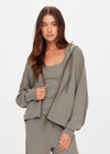 THE UPSIDE women's khaki organic cotton Jude Crop Hoodie is cut in a relaxed, slightly cropped silhouette and features a zip-through opening, a hood with a olive drawcord, ribbed cuffs and hem and front welt pockets. The perfect everyday hoodie, made to last.