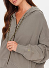 THE UPSIDE women's khaki organic cotton Jude Crop Hoodie is cut in a relaxed, slightly cropped silhouette and features a zip-through opening, a hood with a olive drawcord, ribbed cuffs and hem and front welt pockets. The perfect everyday hoodie, made to last.