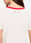 THE UPSIDE women's cream hemp cotton Dusty Ray 70'S Tee is true to size and features a contrast red neckline. Made for everyday wear.
