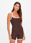 THE UPSIDE women's chocolate Rhythm Caleb Tank Top features a scooped front neckline with t-bar back and removable cups in our recycled rib fabrication. Made for yoga and pilates.