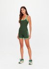 THE UPSIDE women's green Rhythm 5inch Spin Short is mid-rise and features cream and light green binds along side seams in our recycled rib fabrication. Made for yoga and pilates.