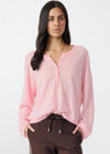 THE UPSIDE women's pink Rylee Knit Button Top is crafted from a lightweight organic cotton linen fabrication and features dropped shoulders and pink pearlised buttons. Made for lifestyle.