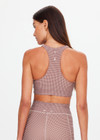 THE UPSIDE women's check Palacio Jetta Racerback Bra is soft and supportive, with removable bust cups and breathable, quick-drying fabric. Made for yoga and pilates.