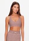 THE UPSIDE women's check Palacio Jetta Racerback Bra is soft and supportive, with removable bust cups and breathable, quick-drying fabric. Made for yoga and pilates.