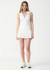 THE UPSIDE women’s white Game Karina Pleated Skirt features built-in inner shorts and pockets in recycled, soft-peached fabric. Made for tennis.