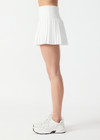 THE UPSIDE women’s white Game Karina Pleated Skirt features built-in inner shorts and pockets in recycled, soft-peached fabric. Made for tennis.