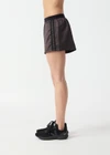 THE UPSIDE women’s brown Levi Run Short is a mid-rise style with a curved hem, ribbed elastic waistband and black mesh tape. Made for running.
