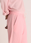 THE UPSIDE women’s pink Cortina Elita Pant is a mid-rise style with a soft elastic waistband, slanted side-seam pockets and cream piping. Made for lifestyle.