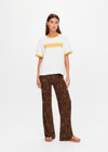 THE UPSIDE women’s natural organic cotton Morning Jacob Tee is an oversized fit with a butterscotch ribbed collar and Morning graphic printed at front chest. Made for lifestyle.