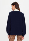 THE UPSIDE women's navy organic cotton Wonder Knit Polo is designed for a relaxed fit and features long sleeves with a contrast cream collar and placket. Made for lifestyle.