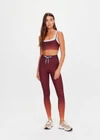 THE UPSIDE women's red Maya 25 Inch Legging is a mid-rise fit and features an elasticated drawcord in light blue with aglets. Made for yoga and pilates.