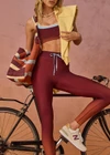 THE UPSIDE women's red Maya 25 Inch Legging is a mid-rise fit and features an elasticated drawcord in light blue with aglets. Made for yoga and pilates.
