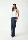 THE UPSIDE women's stripe Wool Elita Pant is a mid-rise, wide leg pant and features cream piping along side seams and maroon paracord drawcord. Made for lifestyle.