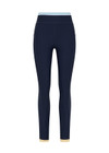 THE UPSIDE women's navy recycled nylon Hermosa 25 Inch Pocket Legging is mid rise and features a contrast hem cuff in butter and pockets at the side. Made for yoga and pilates.