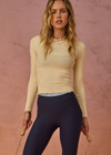 THE UPSIDE women's yellow organic cotton Arlo Pointelle Long Sleeve Top is a soft and comfortable fit and features a crew neck and ruffle lace edge tonal trim. Made for lifestyle.